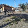 Military officials inspect the area where the bombs were dropped in Pochon