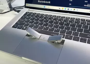 2-in-1: A Chinese company has unveiled a laptop with wireless headphones built into the touchpad
