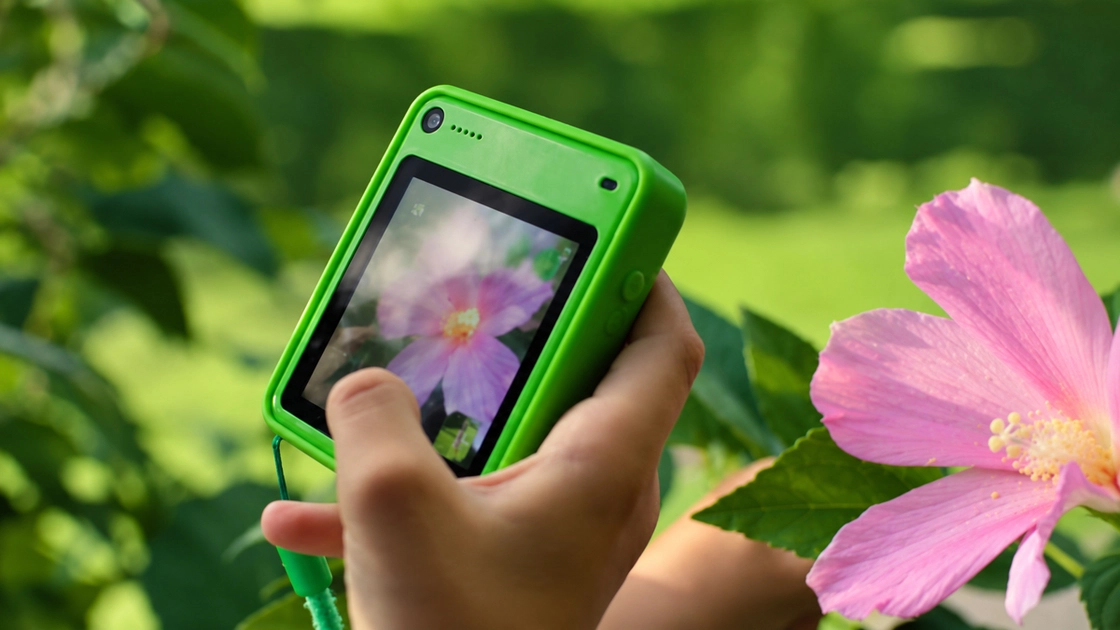 The Freckle phone, a compact square device for ages 7 to 13.