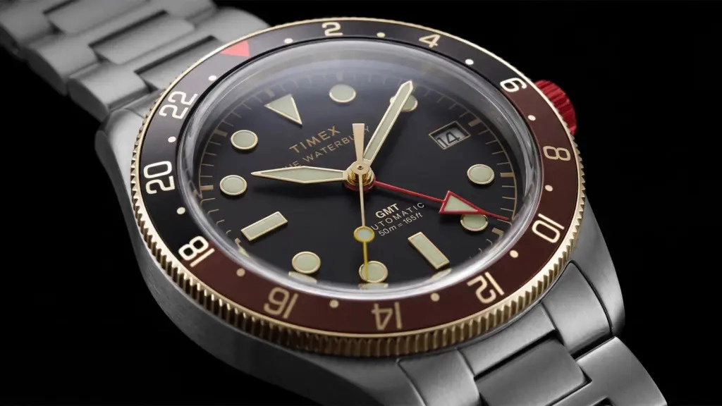 Timex Waterbury Heritage Automatic — blue dial 39mm day-date model with silver stainless steel bracelet.