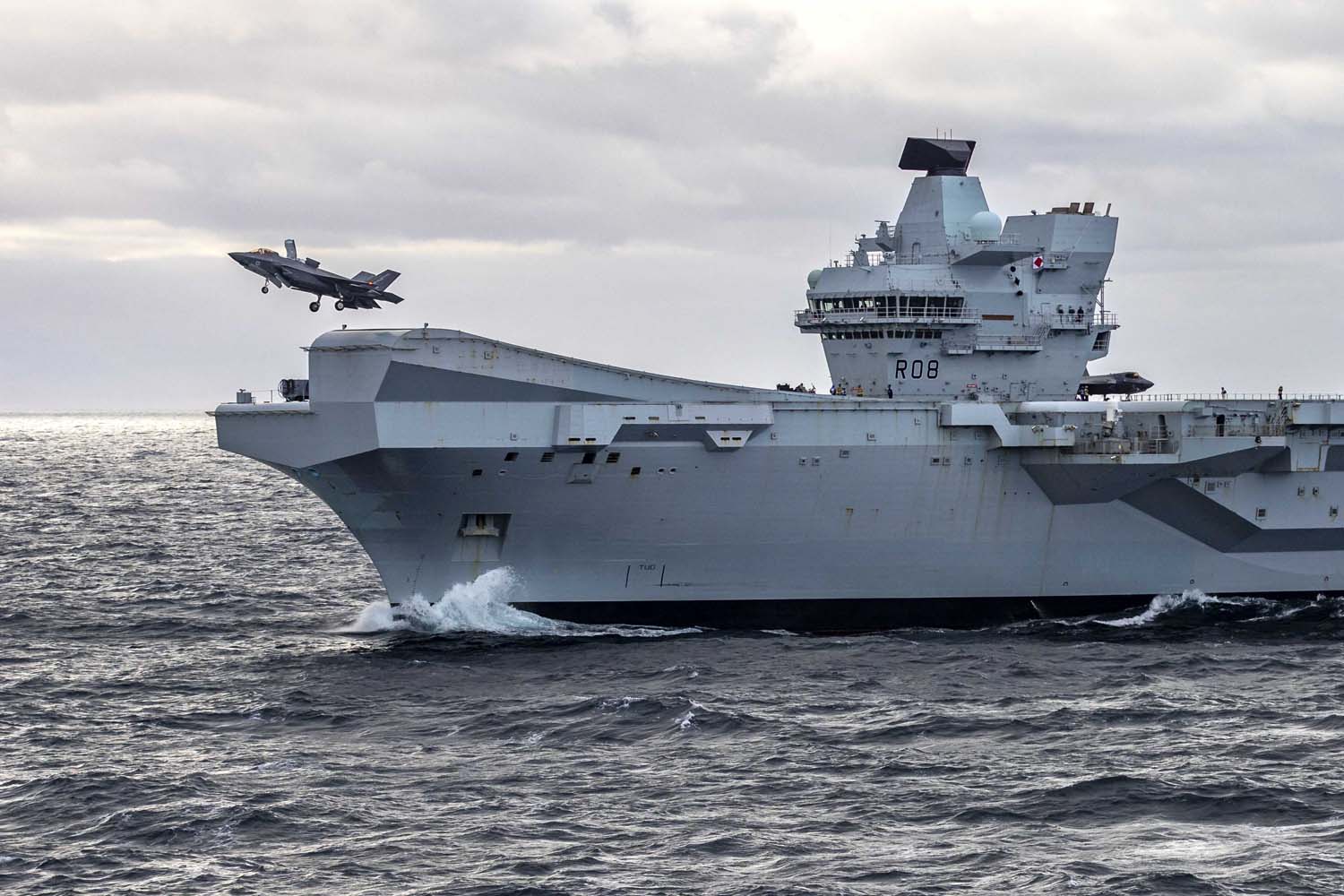 The British aircraft carrier HMS Queen Elizabeth, carrying fifth-generation F-35B Lightning II fighters, has transferred to NATO command for the first time in history-13