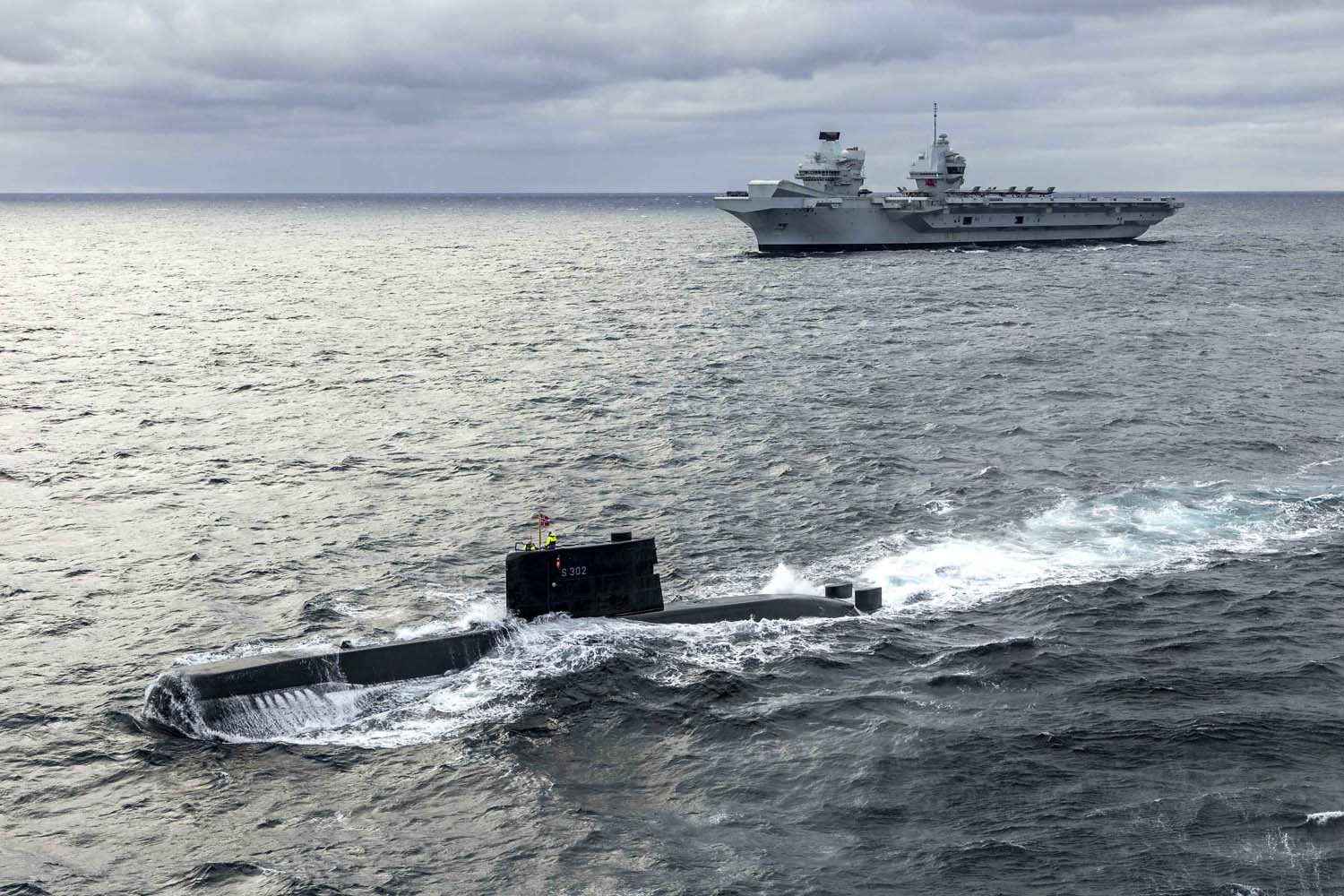 The British aircraft carrier HMS Queen Elizabeth, carrying fifth-generation F-35B Lightning II fighters, has transferred to NATO command for the first time in history-18